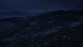 4K day for night color corrected aerial footage fly over mountain slopes, evergreen forest and aspen trees, Fishlake National Forest, Utah Aerial Stock Footage | AX130_200_DFN