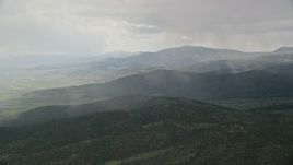5.5K aerial stock footage of rain falling on mountains in Fishlake National Forest, Utah Aerial Stock Footage | AX130_213