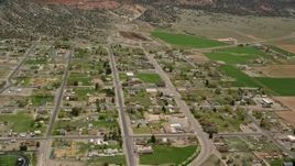 5.5K aerial stock footage of orbiting Wayne High School in small rural town, Bicknell, Utah Aerial Stock Footage | AX130_237E