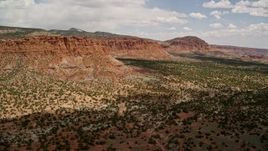 5.5K aerial stock footage pan from mesas and approach a butte, Capitol Reef National Park, Utah Aerial Stock Footage | AX130_244E