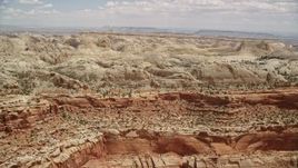 5.5K aerial stock footage of passing by the Waterpocket Fold rock formations, Capitol Reef National Park, Utah Aerial Stock Footage | AX130_264E