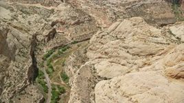 5.5K aerial stock footage of orbiting desert road, Waterpocket Fold rock formations, Capitol Reef National Park, Utah Aerial Stock Footage | AX130_278