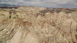 5.5K aerial stock footage of a view of the Waterpocket Fold rock formations, Capitol Reef National Park, Utah Aerial Stock Footage | AX130_279E