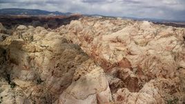 5.5K aerial stock footage of a view of the Waterpocket Fold rock formations, Capitol Reef National Park, Utah Aerial Stock Footage | AX130_281