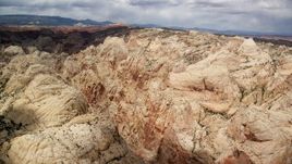 5.5K aerial stock footage fly over and pan across Waterpocket Fold rock formations, Capitol Reef National Park, Utah Aerial Stock Footage | AX130_282