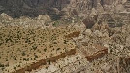 5.5K aerial stock footage orbit top of a mesa, near Waterpocket Fold rock formations, Capitol Reef National Park, Utah Aerial Stock Footage | AX130_293E