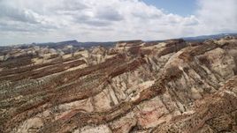5.5K aerial stock footage of the Waterpocket Fold rock formations at Capitol Reef National Park, Utah Aerial Stock Footage | AX130_303