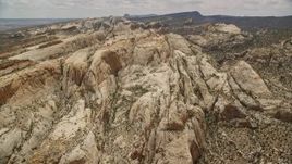 5.5K aerial stock footage fly to the Waterpocket Fold rock formations, Capitol Reef National Park, Utah Aerial Stock Footage | AX130_309E
