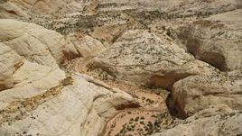 5.5K aerial stock footage orbit canyon twisting through Waterpocket Fold rock formations, Capitol Reef National Park, Utah Aerial Stock Footage | AX130_314