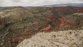 5.5K aerial stock footage flying by canyons, mesas, beside Waterpocket Fold, Capitol Reef National Park, Utah Aerial Stock Footage | AX130_326E