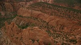 5.5K aerial stock footage of flying by a butte, near mesas, Capitol Reef National Park, Utah Aerial Stock Footage | AX130_335