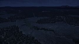4K day for night color corrected aerial footage of flying over desert valley, green vegetation, Dixie National Forest, Utah Aerial Stock Footage | AX130_346_DFN