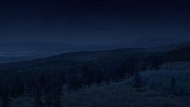 4K day for night color corrected aerial footage of flying over mountain ridge, approaching mountains, Dixie National Forest, Utah Aerial Stock Footage | AX130_360_DFN