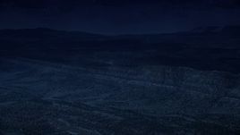 4K day for night color corrected aerial footage of approaching a mountain ridge from over a wide valley, Grand Staircase-Escalante National Monument, Utah Aerial Stock Footage | AX130_396_DFN