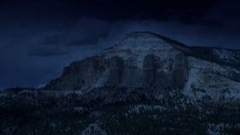 4K day for night color corrected aerial footage of flying by the side of a mesa, Barney Top Mesa, Utah Aerial Stock Footage | AX130_401_DFN