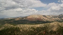 5.5K aerial stock footage of wide view of a mesa, desert vegetation in the foreground, Barney Top Mesa, Utah Aerial Stock Footage | AX130_412