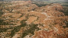 5.5K aerial stock footage of hills around a mesa, groups of hoodoos, Bryce Canyon National Park, Utah Aerial Stock Footage | AX130_438E