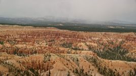 5.5K aerial stock footage of groups of hoodoos and buttes at Bryce Canyon National Park, Utah Aerial Stock Footage | AX130_473E