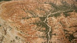 5.5K aerial stock footage of circling around groups of hoodoos and buttes on a cliffside, Bryce Canyon National Park, Utah Aerial Stock Footage | AX130_481E