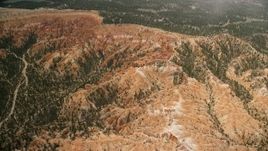 5.5K aerial stock footage approach, tilt to buttes and hoodoos, Bryce Canyon National Park, Utah Aerial Stock Footage | AX130_486E