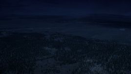 4K day for night color corrected aerial footage of flying by forest and valleys outside the national park, Bryce Canyon National Park, Utah Aerial Stock Footage | AX130_492_DFN