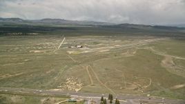 5.5K aerial stock footage of orbiting single runway, wood hangar, Bryce Canyon Airport, Utah Aerial Stock Footage | AX130_496E