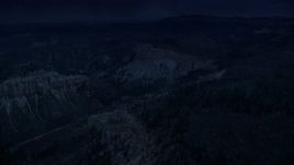 4K day for night color corrected aerial footage of flying by Mud Canyon Butte, Bryce Canyon National Park, Utah Aerial Stock Footage | AX131_015_DFN
