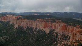 5.5K aerial stock footage of passing by rock formations, Pink Cliffs, trees, Bryce Canyon National Park, Utah Aerial Stock Footage | AX131_021E