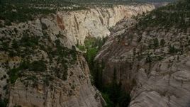 5.5K aerial stock footage of flying through narrow canyon, Grand Staircase-Escalante National Monument, Utah Aerial Stock Footage | AX131_047E