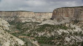 5.5K aerial stock footage of flying low through canyon, Grand Staircase-Escalante National Monument, Utah Aerial Stock Footage | AX131_053