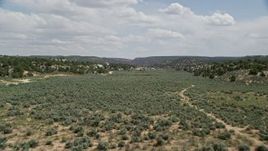 5.5K aerial stock footage fly over hills and trees, Grand Staircase-Escalante National Monument, Utah Aerial Stock Footage | AX131_065E