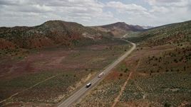 5.5K aerial stock footage track a car on Highway 89, Glen Canyon National Recreation Area, Utah, Arizona Aerial Stock Footage | AX131_088E