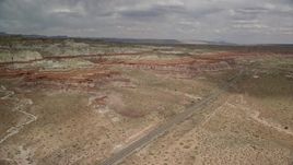 5.5K aerial stock footage of following Highway 89 toward rock formations, Glen Canyon National Recreation Area, Utah, Arizona Aerial Stock Footage | AX131_099E