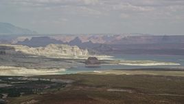 5.5K aerial stock footage of Lone Rock and Lake Powell by Glen Canyon National Recreation Area, Utah, Arizona Aerial Stock Footage | AX131_121