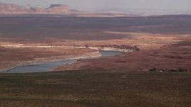 5.5K aerial stock footage of flying by Lake Powell, Glen Canyon National Recreation Area, Utah, Arizona Aerial Stock Footage | AX131_129