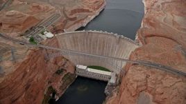 5.5K aerial stock footage of circling above the Glen Canyon Dam and Bridge, Arizona Aerial Stock Footage | AX131_139E