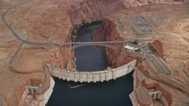 5.5K aerial stock footage orbit above the Glen Canyon Dam and Bridge, Arizona Aerial Stock Footage | AX131_142E