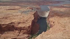 5.5K aerial stock footage of following Colorado River to approach the Glen Canyon Dam and Bridge, Arizona Aerial Stock Footage | AX131_145E