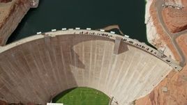 5.5K aerial stock footage tilt to bird's eye view of Glen Canyon Dam and Bridge, Arizona Aerial Stock Footage | AX131_148