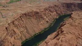 5.5K aerial stock footage of flying over canyon and the Colorado River, Glen Canyon, Arizona Aerial Stock Footage | AX131_154E