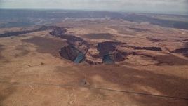 5.5K aerial stock footage of flying to the edge of Horseshoe Bend, tilt to Colorado River, Glen Canyon, Arizona Aerial Stock Footage | AX131_174E