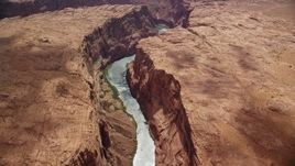 5.5K aerial stock footage of flying by a bend in the Colorado River at the bottom of Glen Canyon, Arizona Aerial Stock Footage | AX131_181E