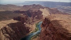 5.5K aerial stock footage of flying over Colorado River, bordered by rugged cliffs, Glen Canyon, Arizona Aerial Stock Footage | AX131_187