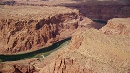 5.5K aerial stock footage of flying over Colorado River through Glen Canyon, Arizona Aerial Stock Footage | AX131_198E