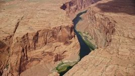 5.5K aerial stock footage of flying over Colorado River, approaching Horseshoe Bend, Glen Canyon, Arizona Aerial Stock Footage | AX131_207E