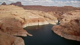 5.5K aerial stock footage of flying over water of Lake Powell canyons and Navajo Canyon, Arizona Aerial Stock Footage | AX131_236E