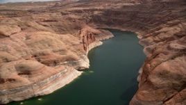 5.5K aerial stock footage of following Lake Powell around a bend in Navajo Canyon, Arizona Aerial Stock Footage | AX131_237
