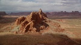 5.5K aerial stock footage of flying by buttes in the desert, Navajo Nation Reservation, Arizona Aerial Stock Footage | AX131_244E