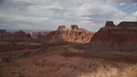 5.5K aerial stock footage of flying by giant buttes in Navajo Nation Reservation, Arizona Aerial Stock Footage | AX132_003