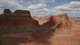 5.5K aerial stock footage of approaching and flying between large buttes, Navajo Nation Reservation, Arizona Aerial Stock Footage | AX132_004E